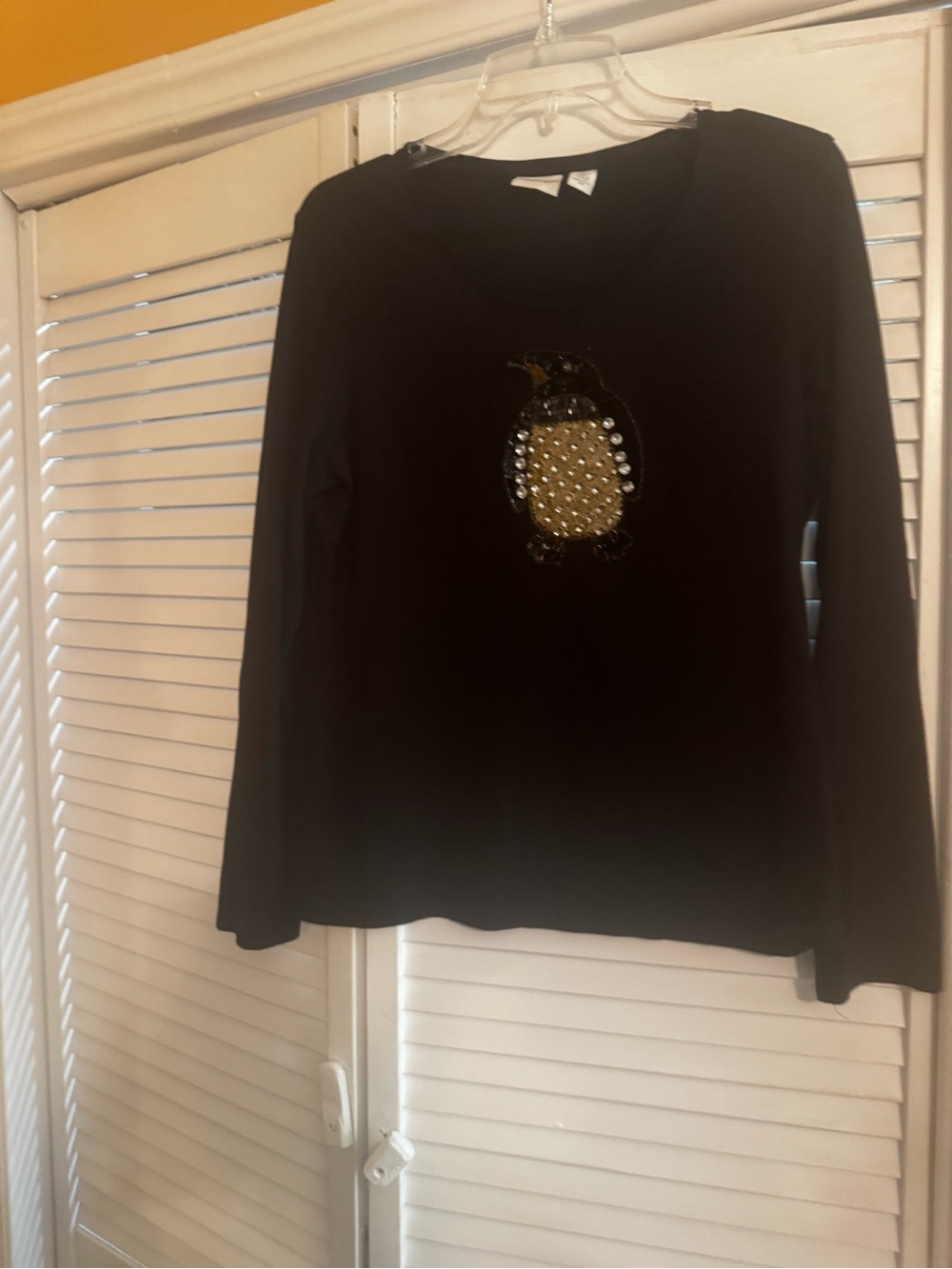 Chico's Black Long-Sleeve Top with Embellished Penguin Motif